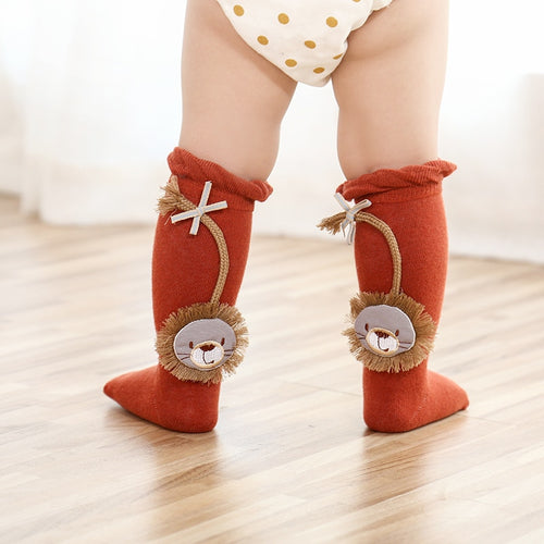 Roar!  Baby Lion socks for your baby lion. Ruffled edge and long bowed tails.